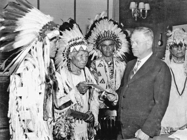 Image: Photo of Secretary of Interior Harold Ickes and delegates of the Confederated Tribes of the Flathead Indian Reservation in 1935.