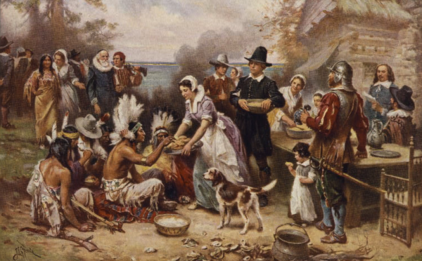 Painting depicting the First Thanksgiving, showing Native Americans and Pilgrims sharing a meal outdoors.